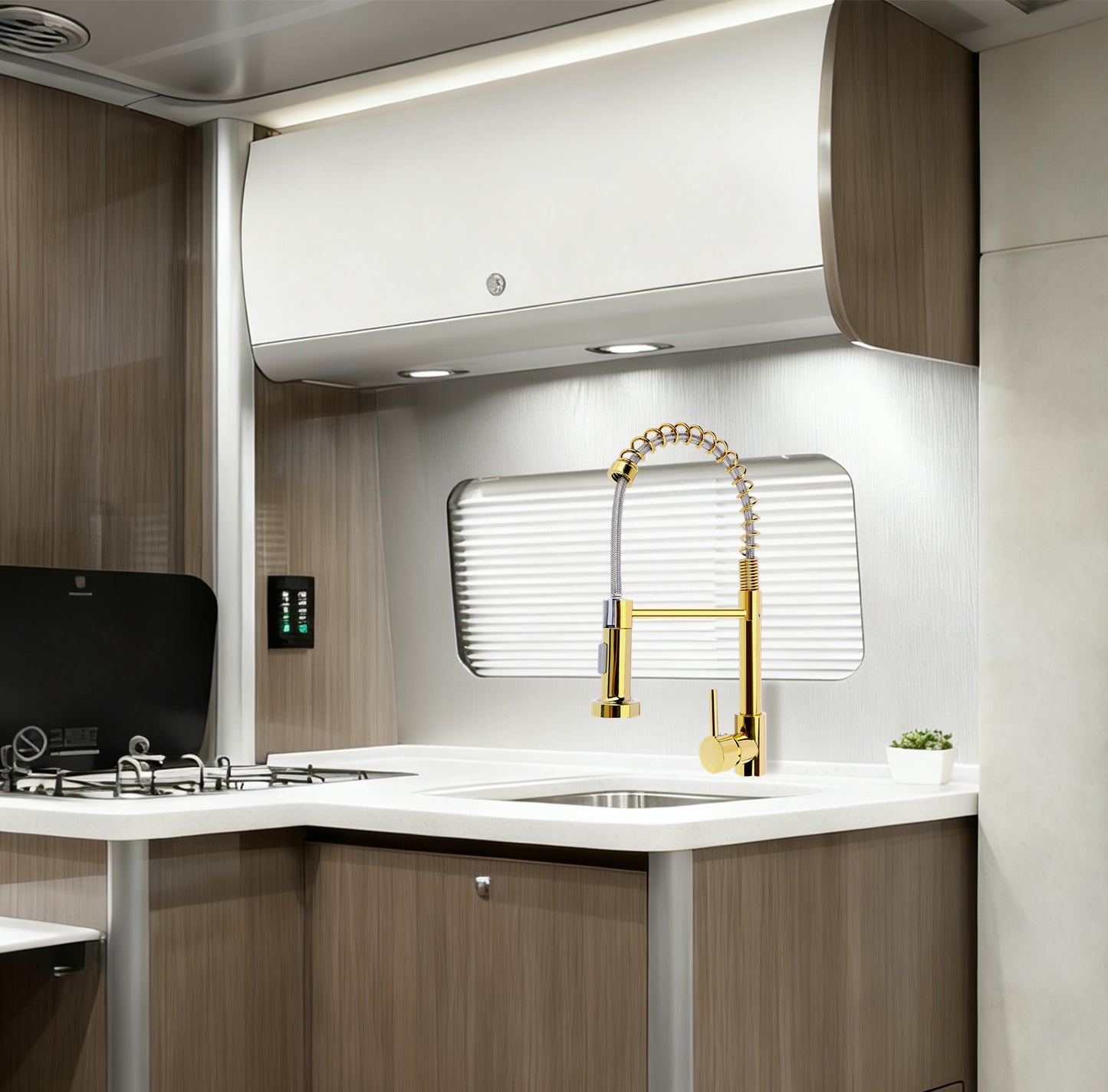 Modern kitchen with gold faucet and white countertop