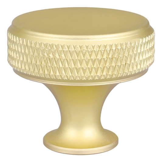 Gold knob with textured surface on a white background