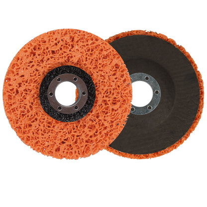 Two orange scrubber pads with black centers on a white background