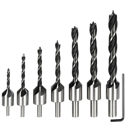 Set of drill bits with metallic shanks on a white background