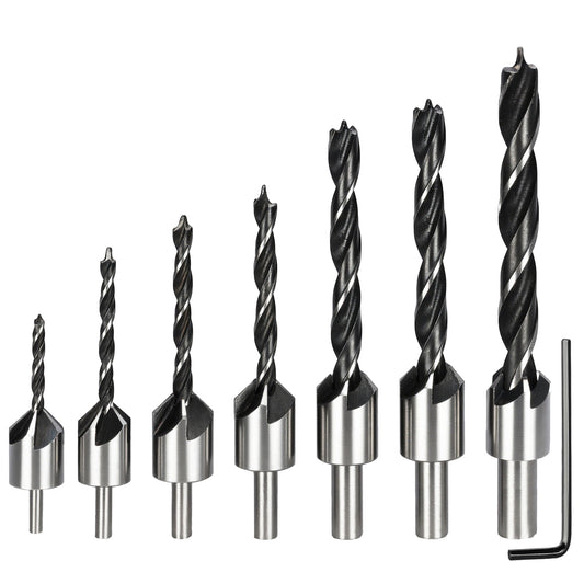 Set of drill bits with metallic shanks on a white background