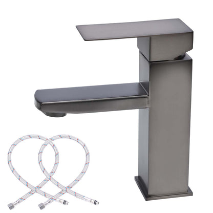 Stainless steel faucet with flexible hose on a white background