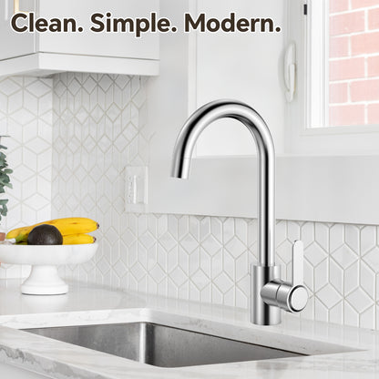 Modern kitchen sink with faucet in a well-lit kitchen setting