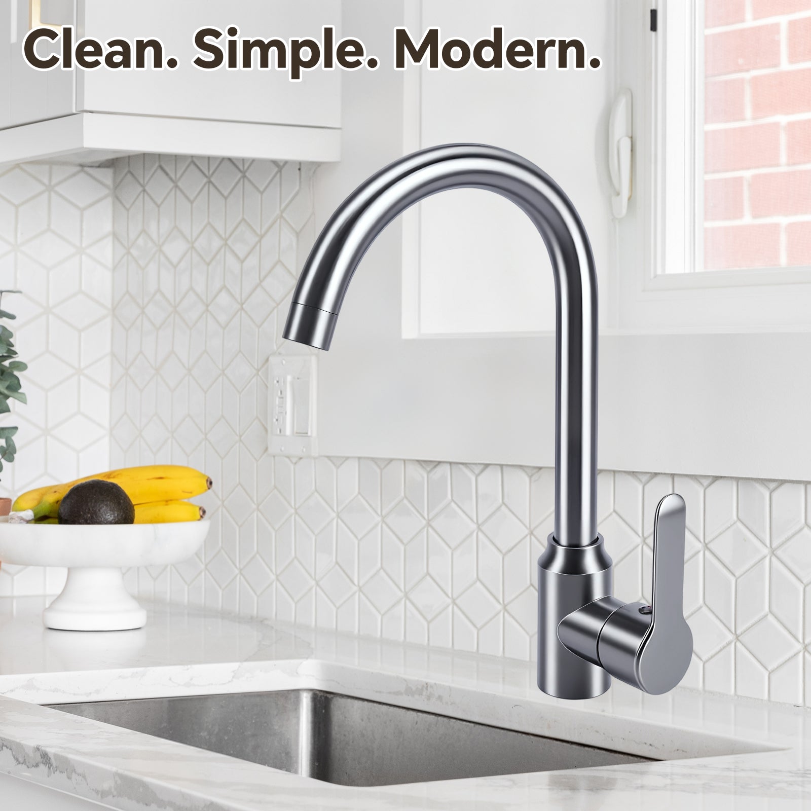 Modern kitchen faucet above a sink with a tiled backsplash and fruit on the counter.