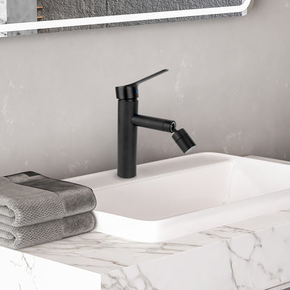 Black faucet on a marble sink with a gray towel and mirror in the background