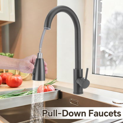 Black pull-down faucet in a kitchen setting with a hand holding the nozzle.