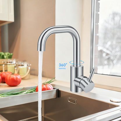 Modern kitchen faucet with water flowing into a sink, set against a kitchen background.