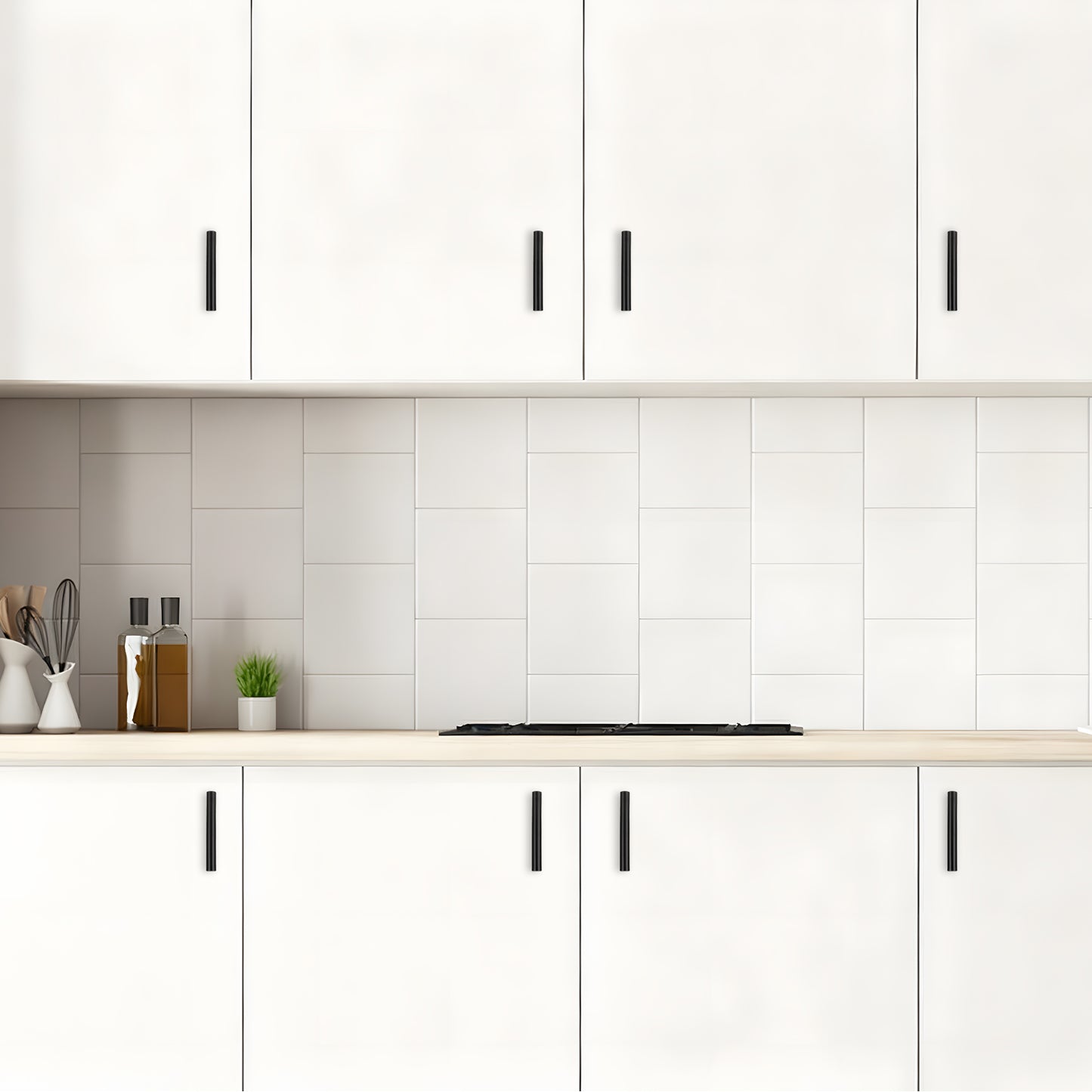 Modern kitchen with white cabinets, tiled backsplash, and countertop.