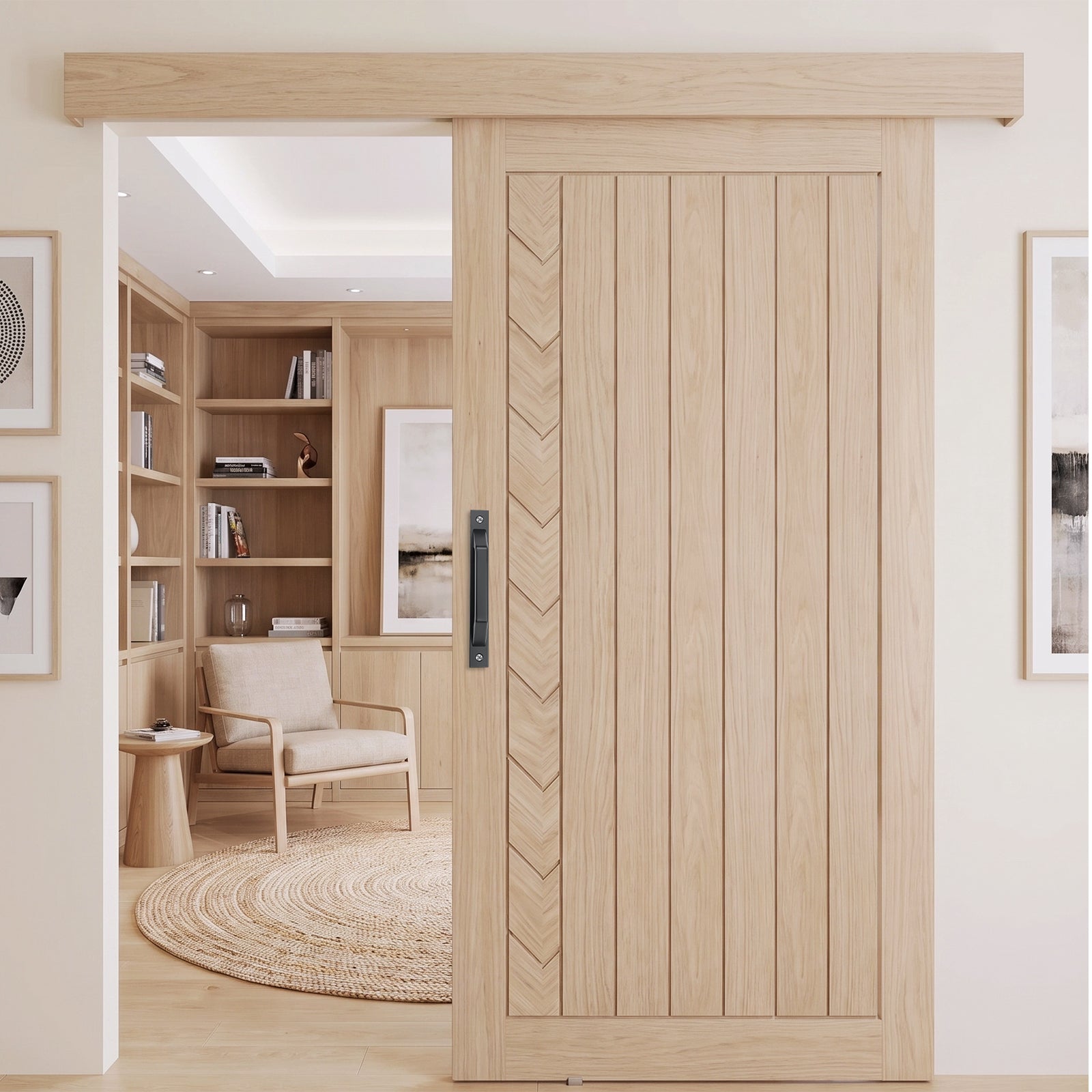 A light natural wood sliding door with vertical panels and a chevron inlay, shown installed in a modern home interior with a built-in bookshelf and chair visible through the opening.