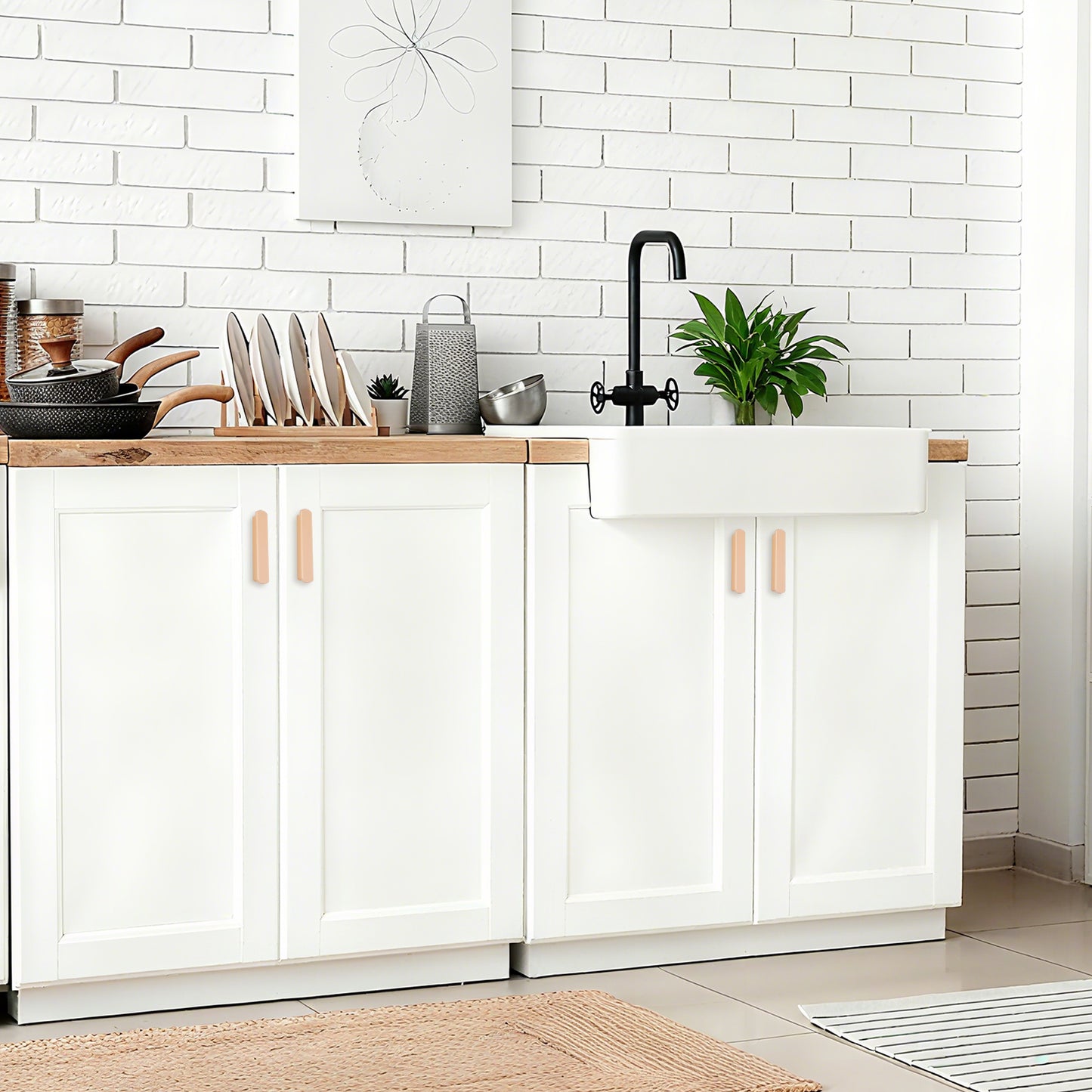 Modern kitchen with white cabinets, wooden countertops, and a white tiled backsplash.