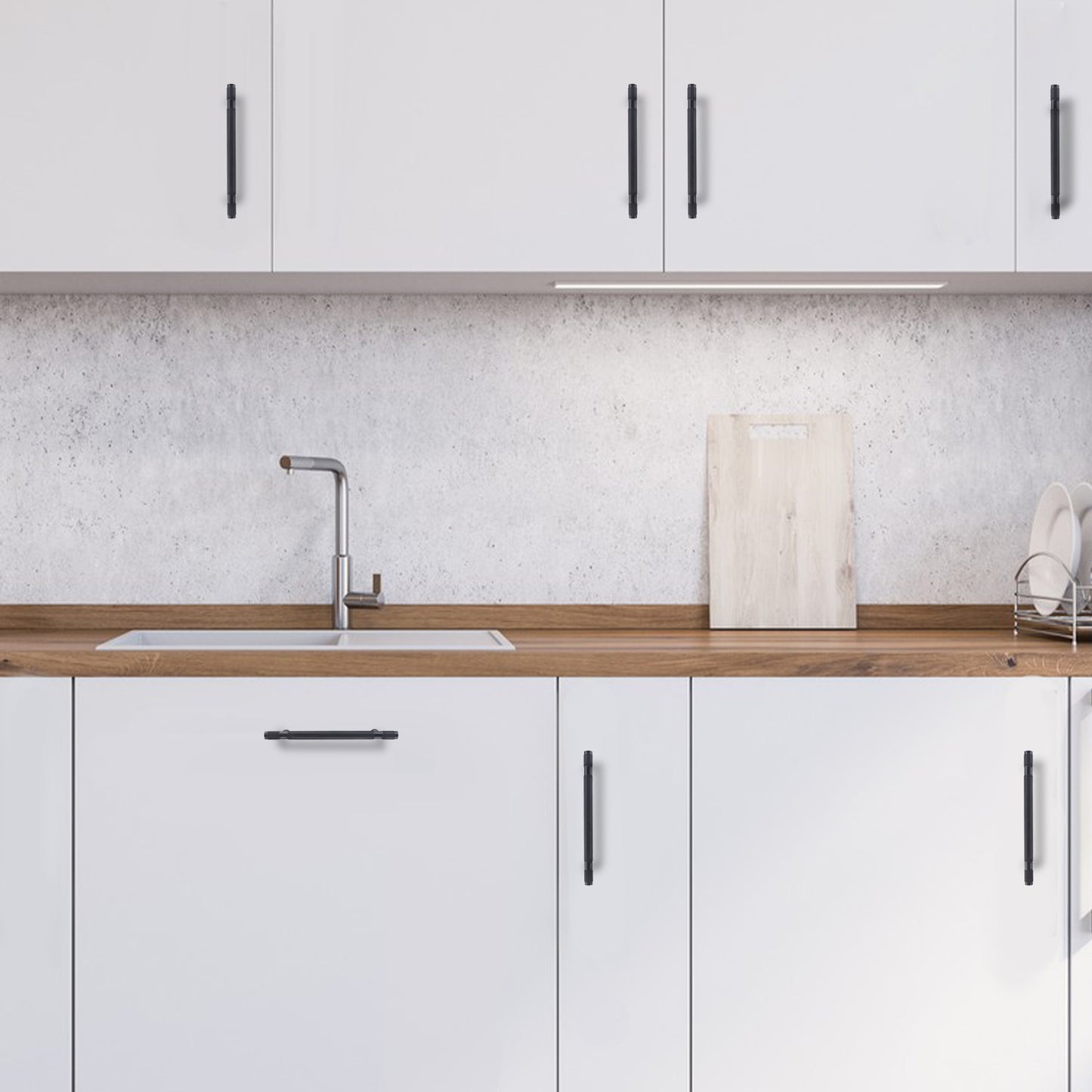 Modern kitchen with white cabinets, wooden countertop, and sink.