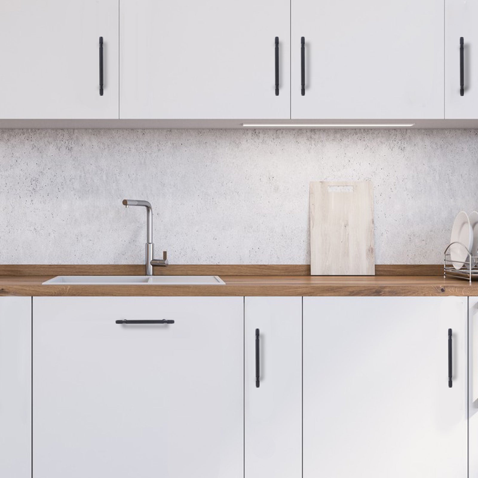 Modern kitchen with white cabinets, wooden countertop, and sink.