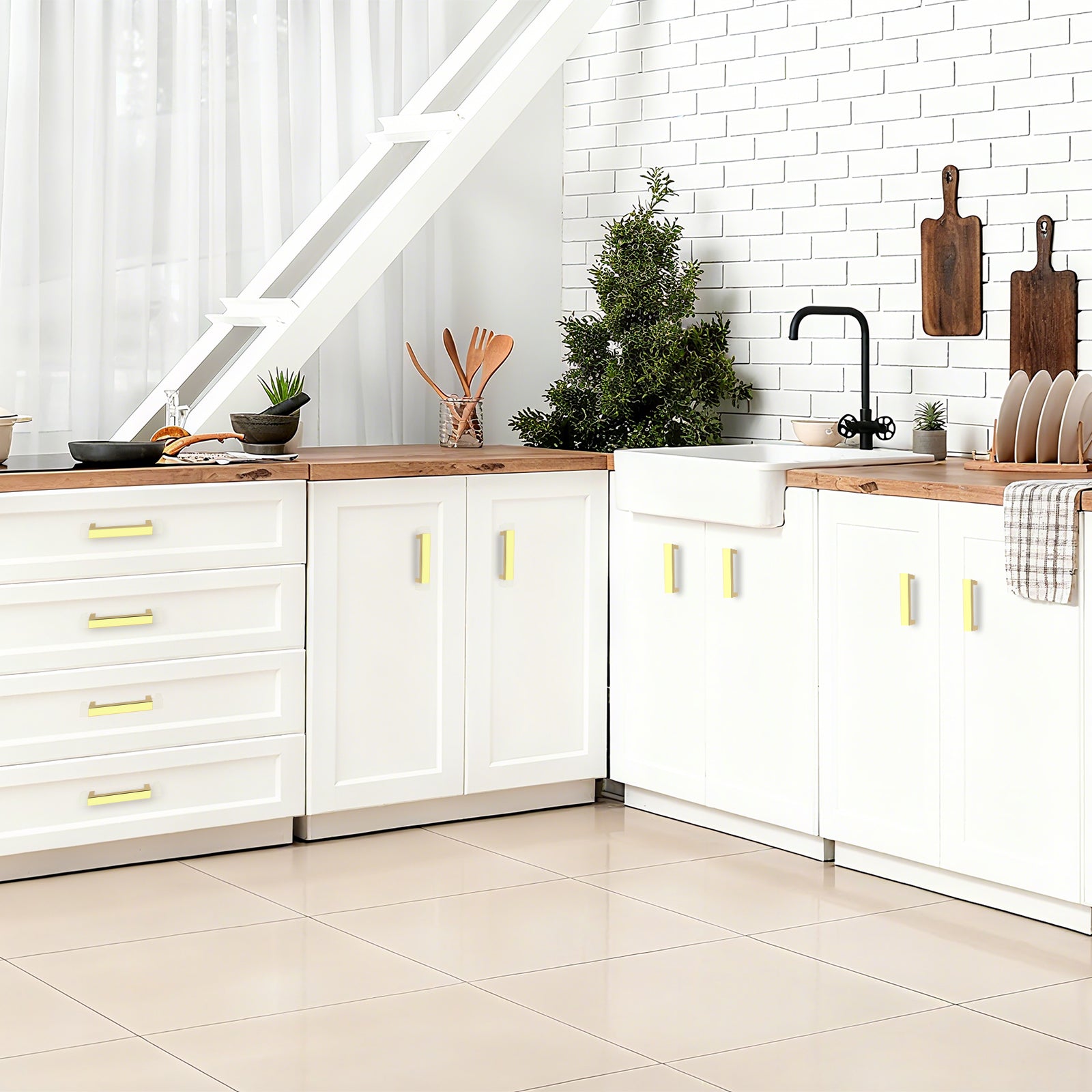Modern kitchen with white cabinets, wooden countertops, and decorative elements.