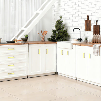 Modern kitchen with white cabinets, wooden countertops, and decorative elements.