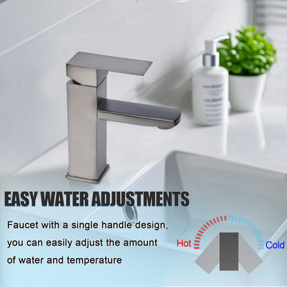 Modern silver faucet with single handle design in a bathroom setting.