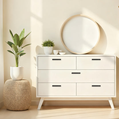 White dresser with four drawers, round mirror, and plants in a room with a neutral color scheme.