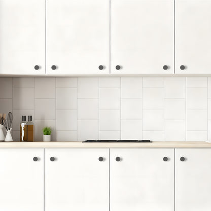 Modern kitchen with white cabinets and tiled backsplash