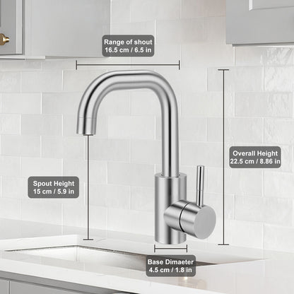 Chrome kitchen faucet with measurements on a tiled wall background