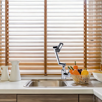 Kitchen sink with faucet and wooden blinds in the background