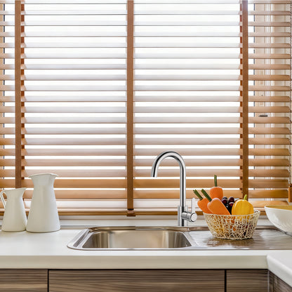 Kitchen sink with wooden blinds in the background