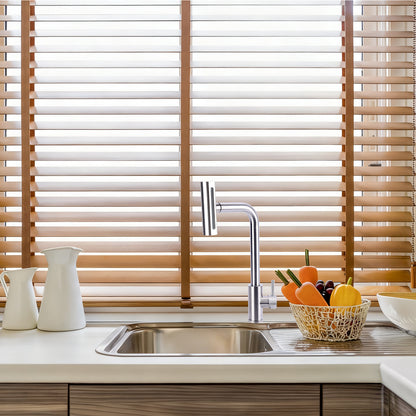 Kitchen sink with wooden blinds in the background