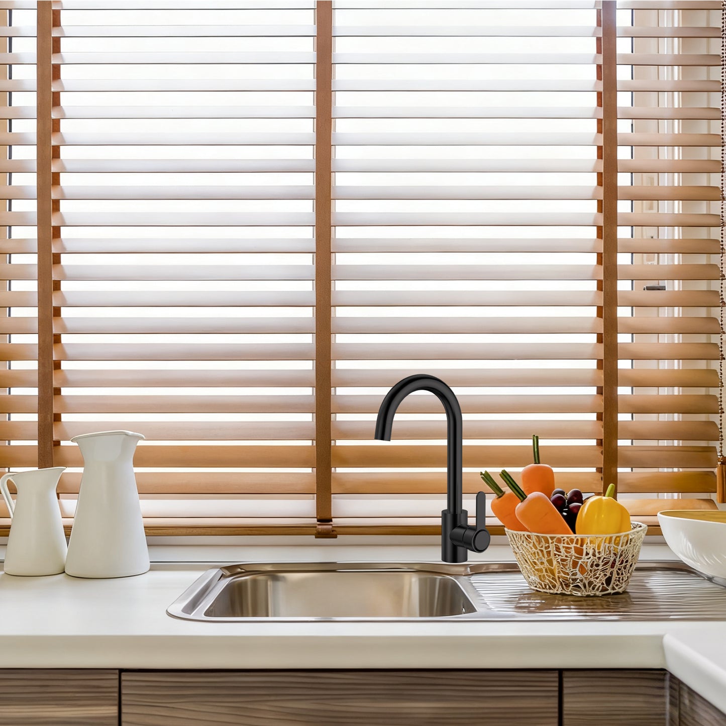 Kitchen sink with wooden blinds in the background