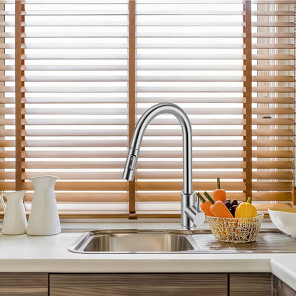 Modern kitchen sink with faucet and wooden blinds in the background