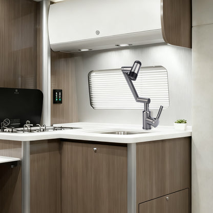 Modern kitchenette with sink, faucet, and stove in a compact space.