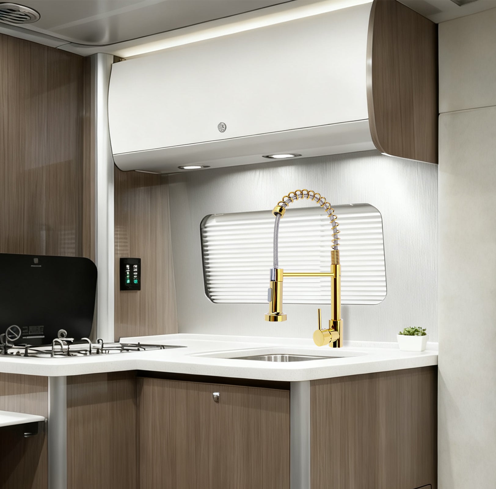 Modern kitchen with gold faucet and white countertop