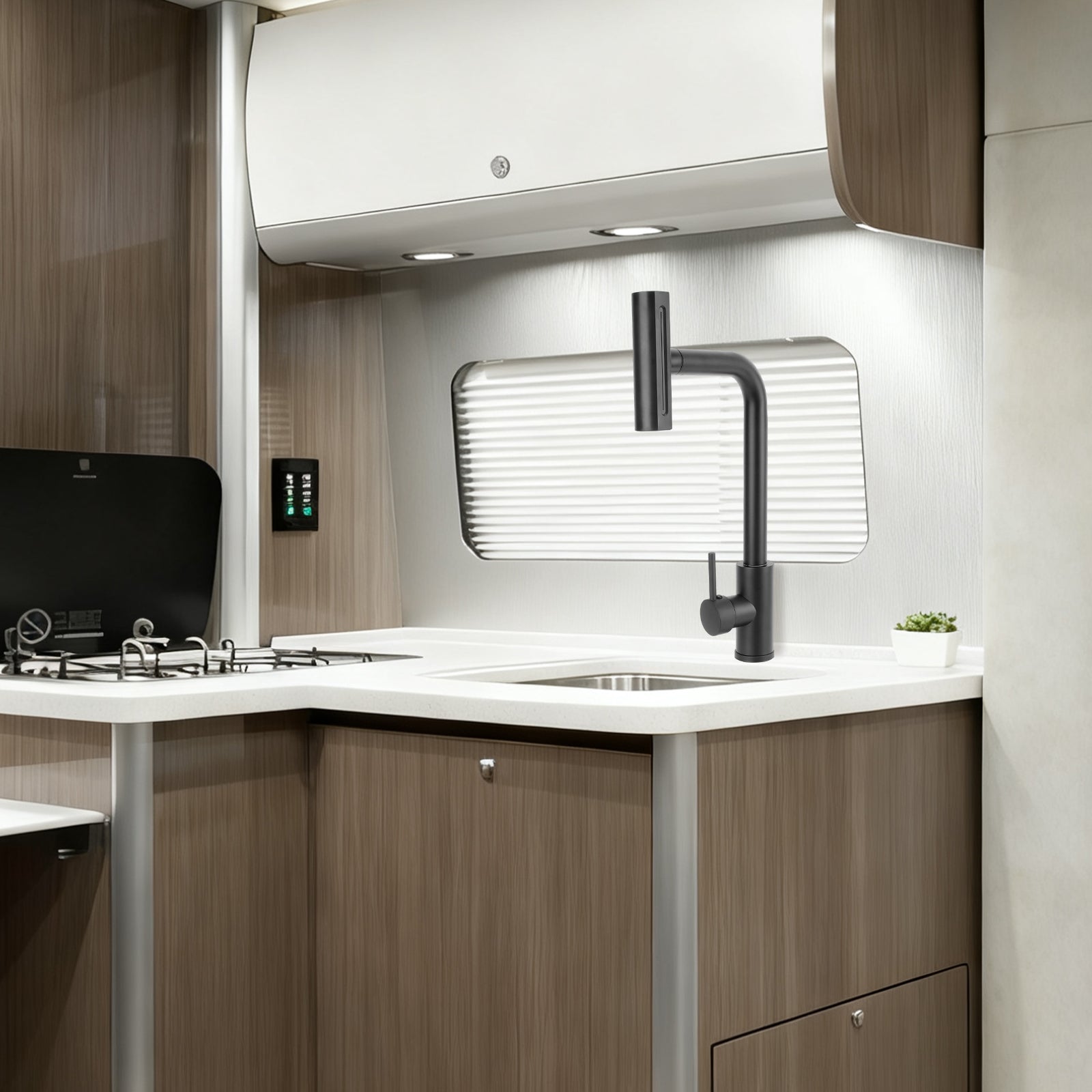 Modern kitchen interior with wooden cabinets, white countertop, and black faucet.
