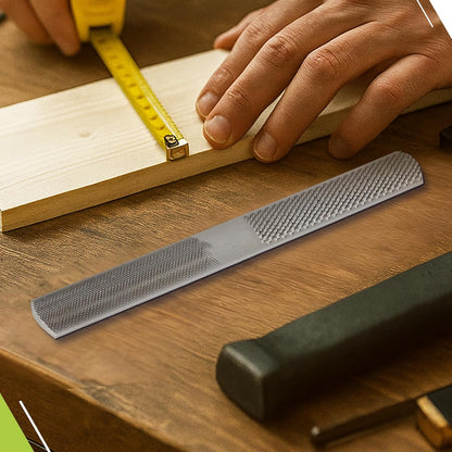 Hand holding a ruler against a piece of wood on a wooden surface with tools nearby.