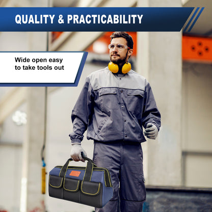 A man in a gray work uniform and safety glasses stands in an industrial setting, holding a blue and gray tool bag with yellow piping. He has yellow ear muffs around his neck.